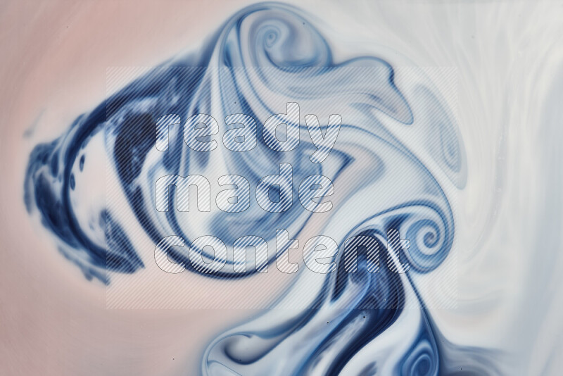 A close-up of abstract swirling patterns in blue, red and white
