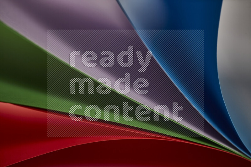 An abstract art showing colorful paper sheets arranged in an overlapping curves