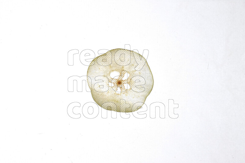 Pear slices on illuminated white background
