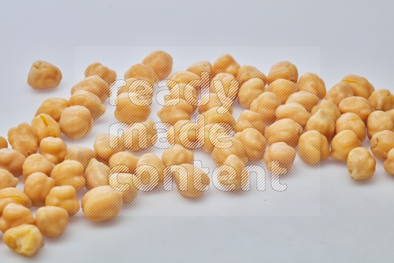 Close up shot of boiled chickpeas on white background