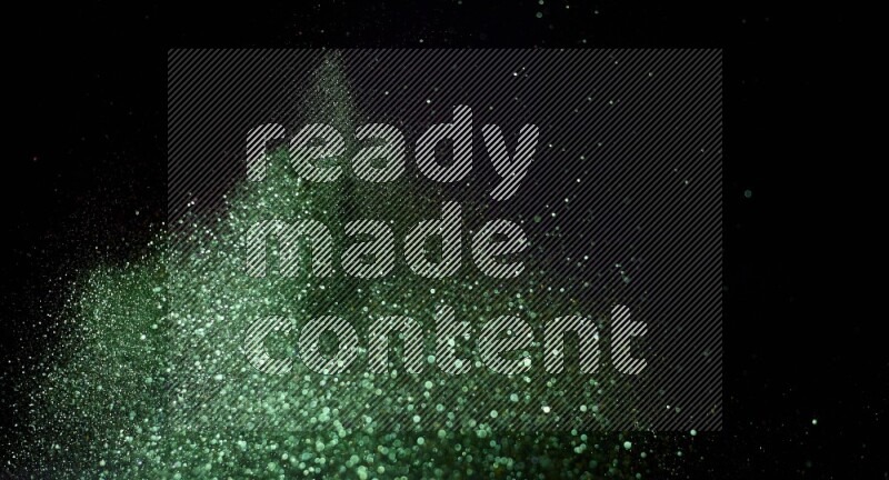 Green glitter powder isolated on black background