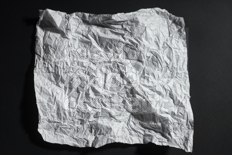 White paper sheet on black background