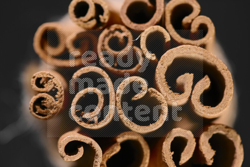 Cinnamon sticks on black background