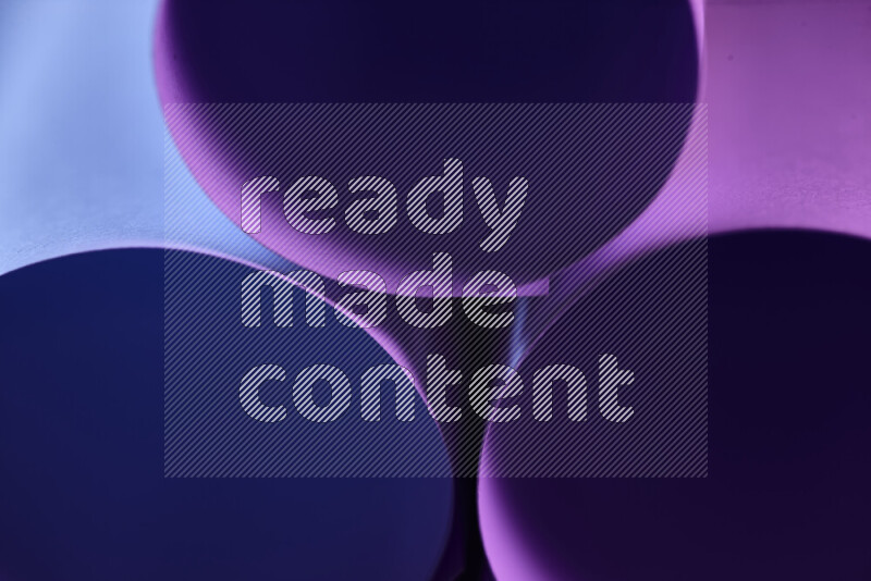 The image shows an abstract paper art with circular shapes in varying shades of purple