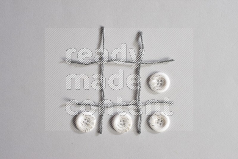 White buttons placed on grey background