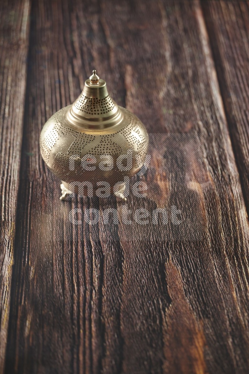 A lantern placed on a wooden background