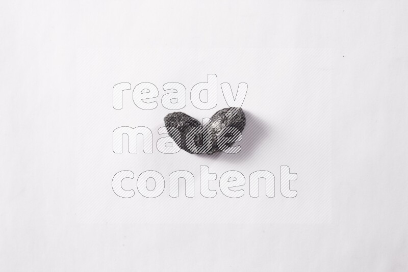 Dried plums on white background