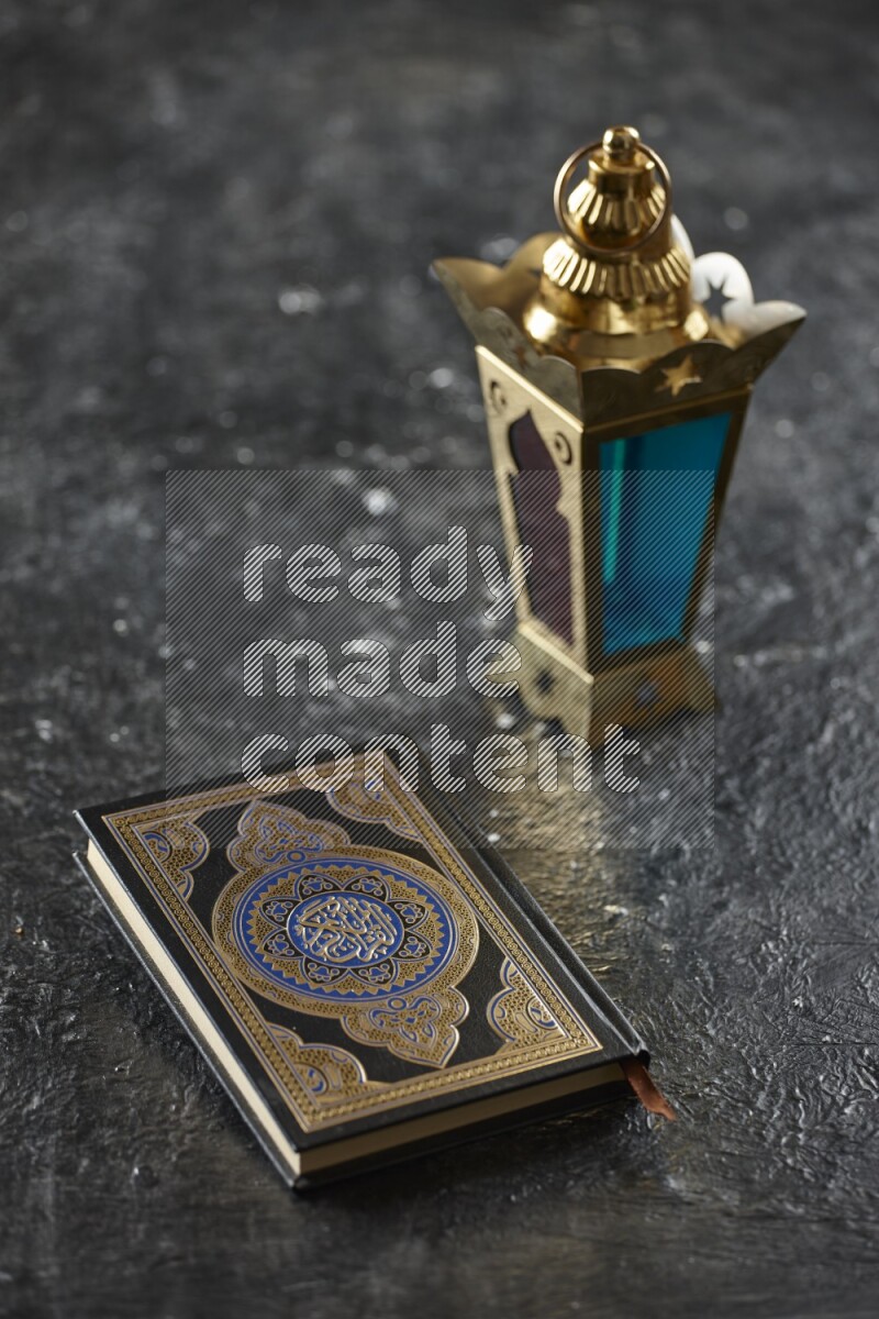 A golden lantern with different drinks, dates, nuts, prayer beads and quran on textured black background