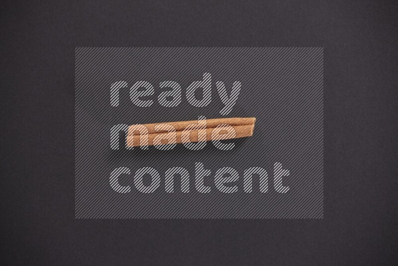 Cinnamon stick on black background