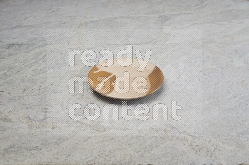 Multicolored Pottery Plate On Grey Marble Flooring