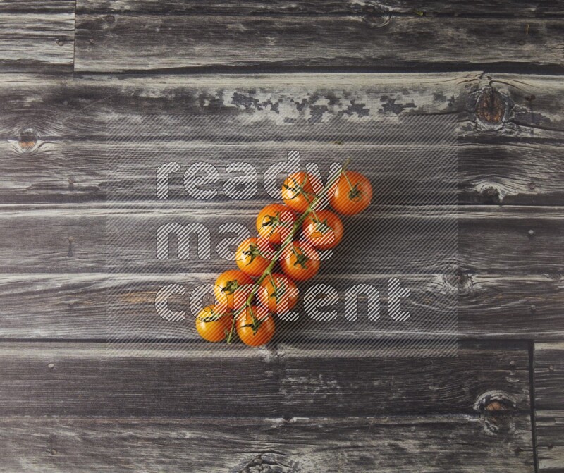 Single cherry tomato vein topview on a grey wooden background