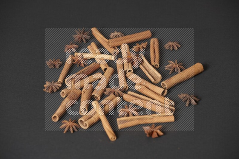 Cinnamon sticks and star anise on black background