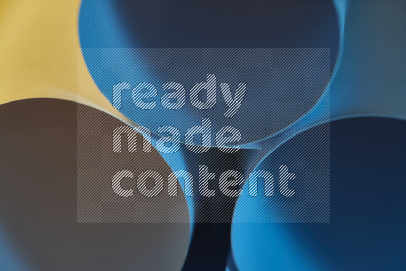 The image shows an abstract paper art with circular shapes in varying shades of blue and warm tones