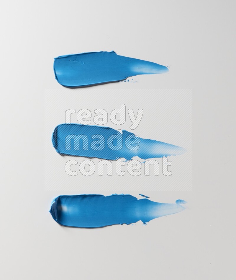Blue painting knife strokes on white background