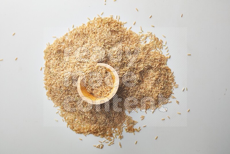 Long grain brown rice on white background