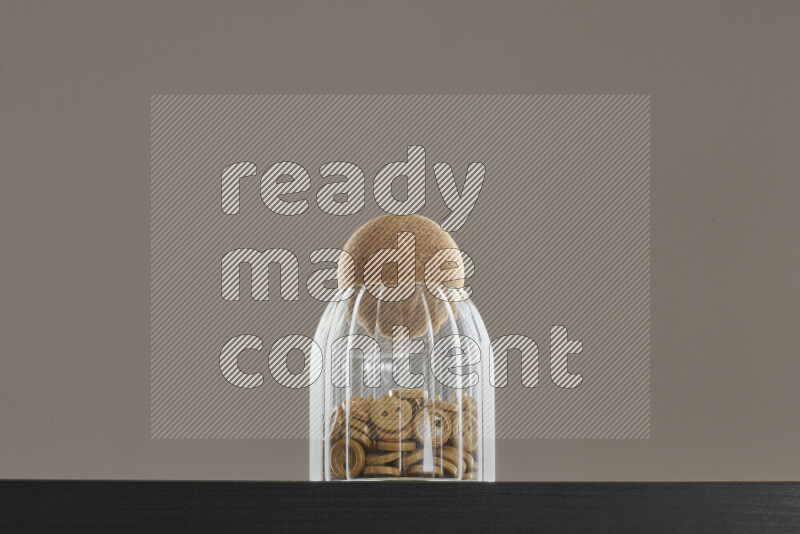 Buttons in a glass jar on black background