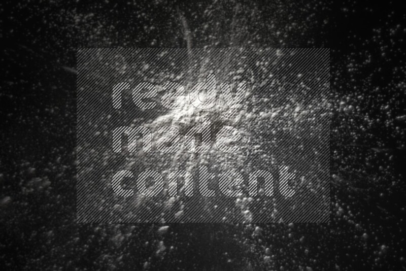 White powder explosion on black background