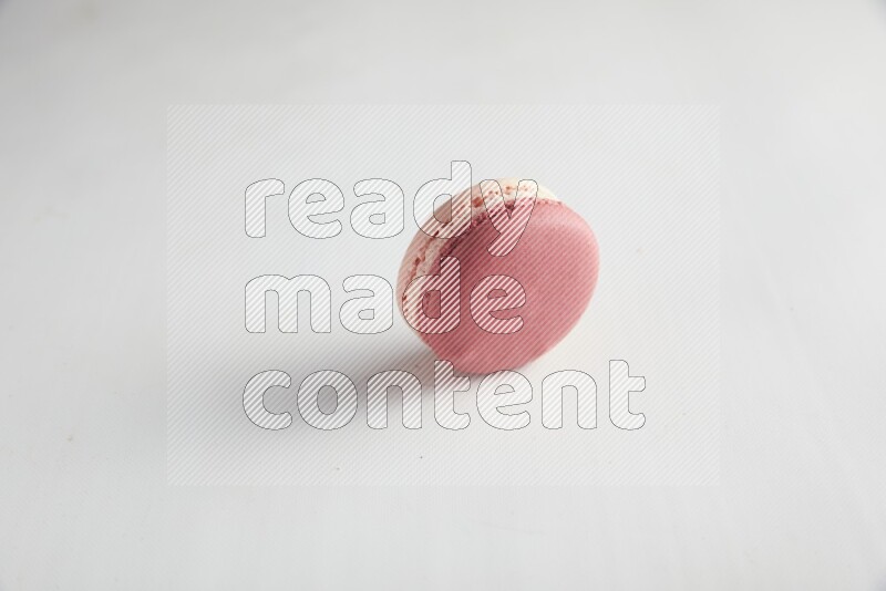 45º Shot of Pink Litchi Raspberry macaron on white background
