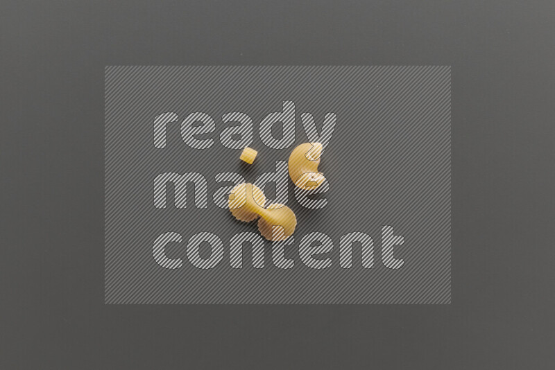 Different pasta types on grey background