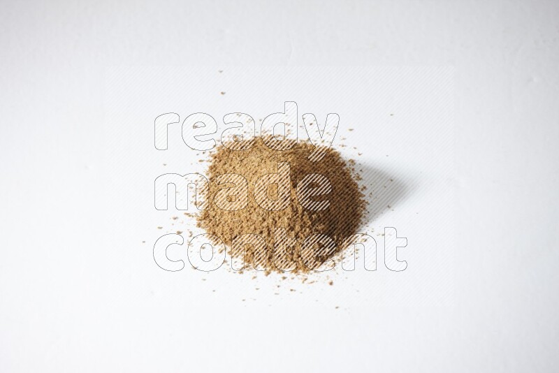 Cumin powder on white flooring