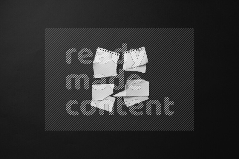 Ripped notebook sheet on black background