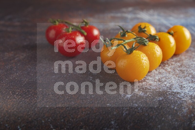 Mixed cherry tomato veins on a textured reddish rustic metal background 45 degree
