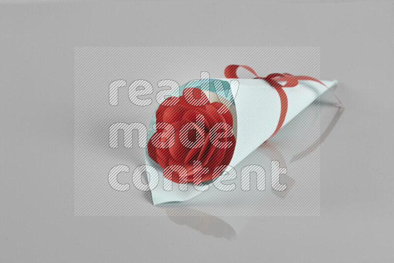 Origami flower bouquet on grey background