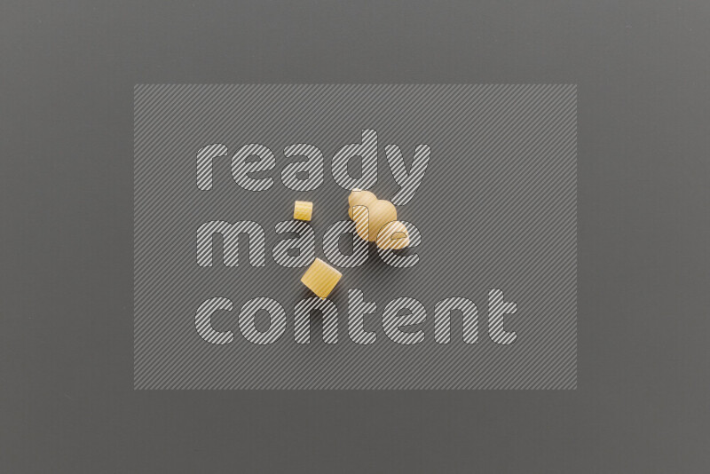 Different pasta types on grey background
