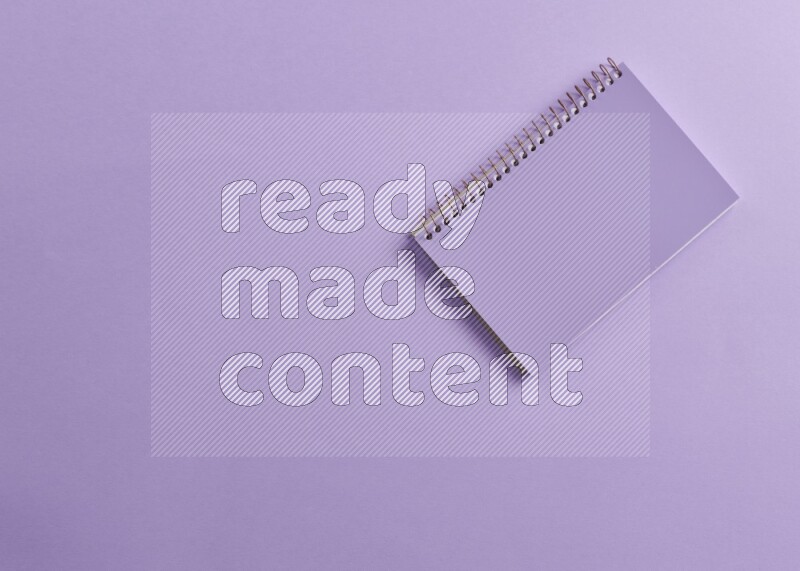 A purple notebook on purple background