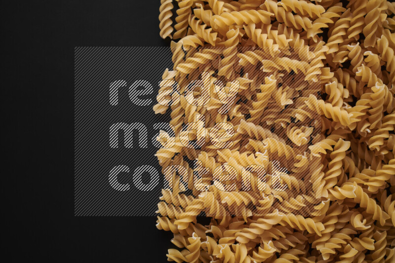 Different pasta types on black background