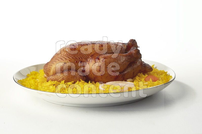 yellow  basmati Rice with kabsa chicken pieces on a white plate with a silver rim direct on white background