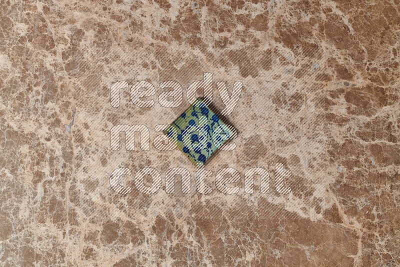 A decorative coaster on beige marble background