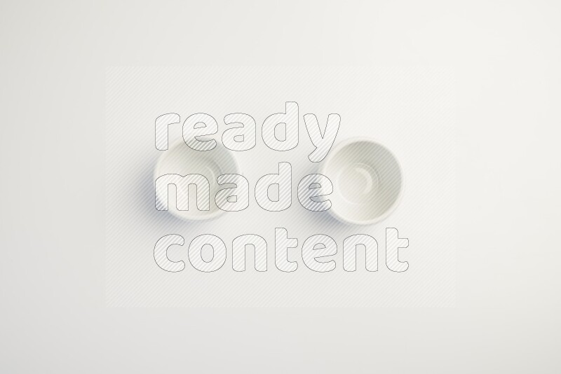 white ceramic round sauce dish on white countertop
