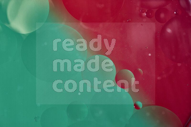 Close-ups of abstract oil bubbles on water surface in shades of green and red