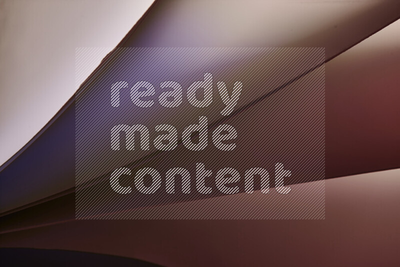 فن تجريدي يعرض منحنيات مع تدرجات الألوان الدافئة والباردة مكونه بضوء ملون