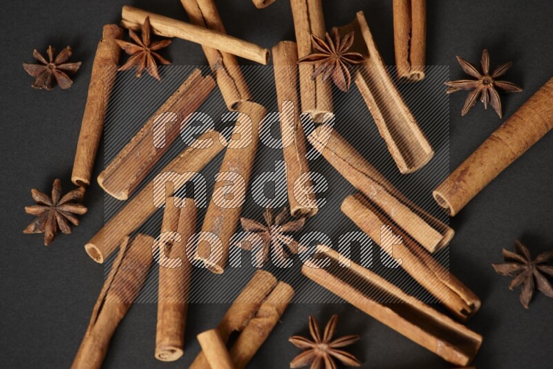 Cinnamon sticks and star anise on black background