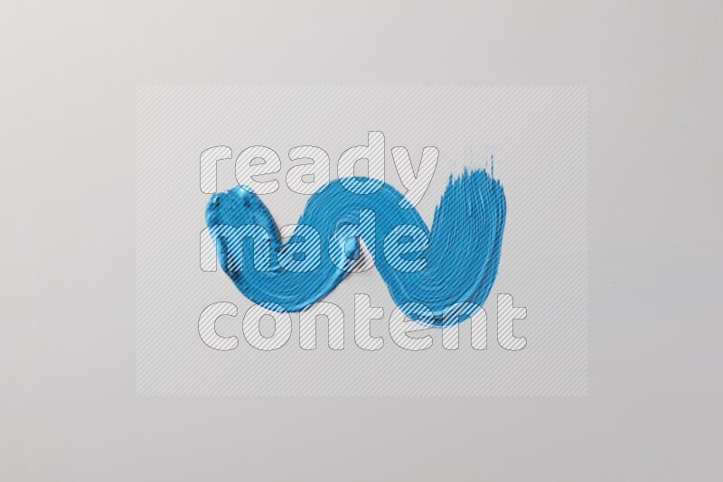 A single blue zigzag brush stroke on a white background