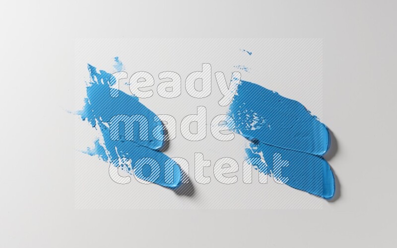 Blue painting knife strokes on white background