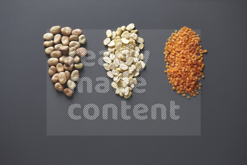 Bunches of legumes on grey background