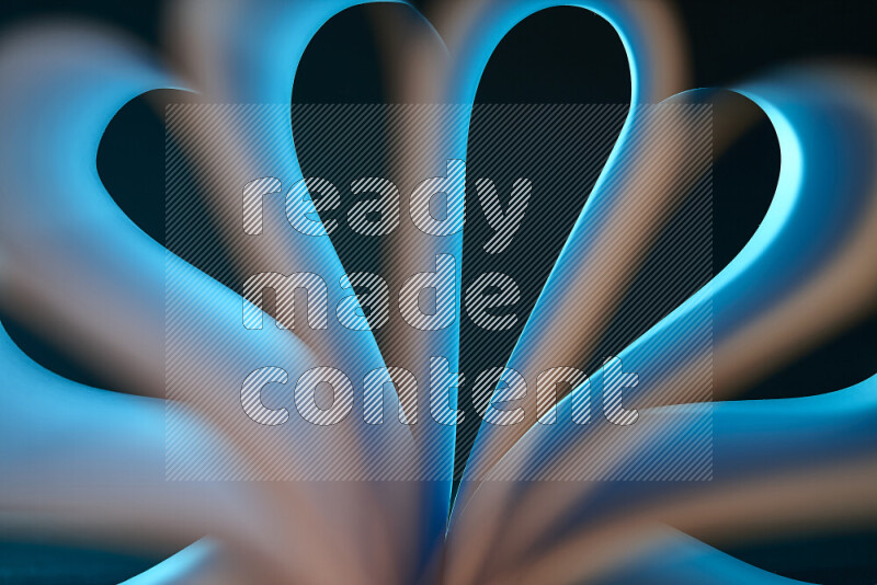 فن تجريدي يعرض منحنيات وتدرجات اللون الأبيض والأزرق مكونه بضوء ملون