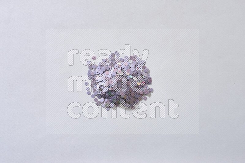 ترتر مسطح متعدد الألوان على خلفية رمادية