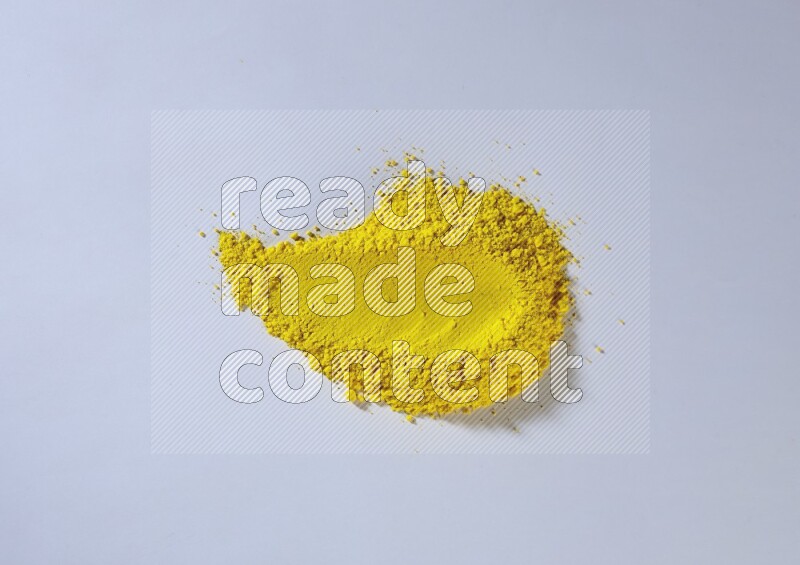 Yellow powder smears on white background