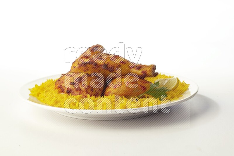 yellow basmati Rice with kabsa chicken pieces on a white rounded plate direct on white background