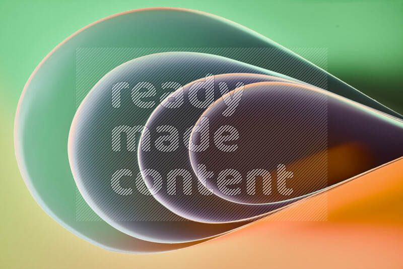 An abstract art of paper folded into smooth curves in green and orange gradients