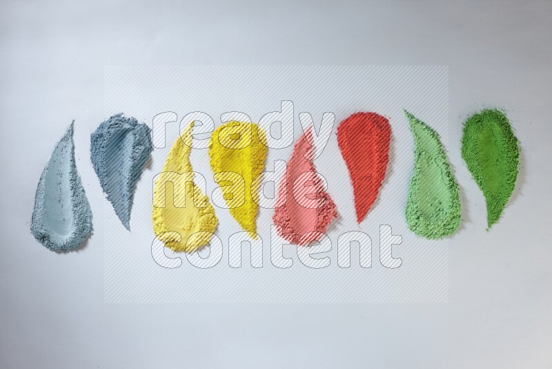 Multicolored powder smears on white background