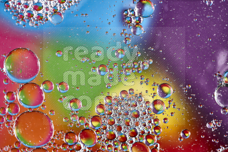 Close-ups of abstract soap bubbles and water droplets on multicolored background