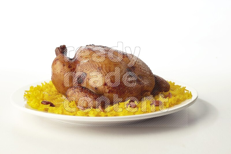 yellow  basmati Rice with  whole roasted chicken on a white rounded plate direct on white background