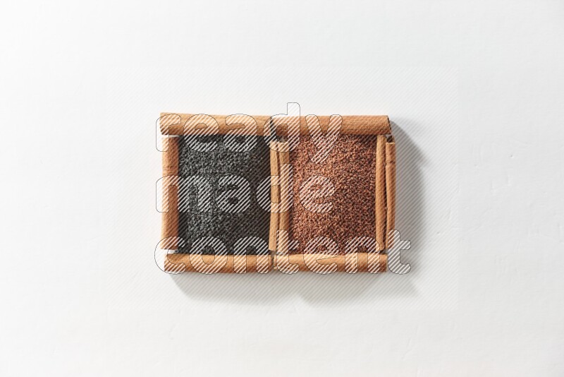 2 squares of cinnamon sticks full of black seeds and garden cress on white flooring