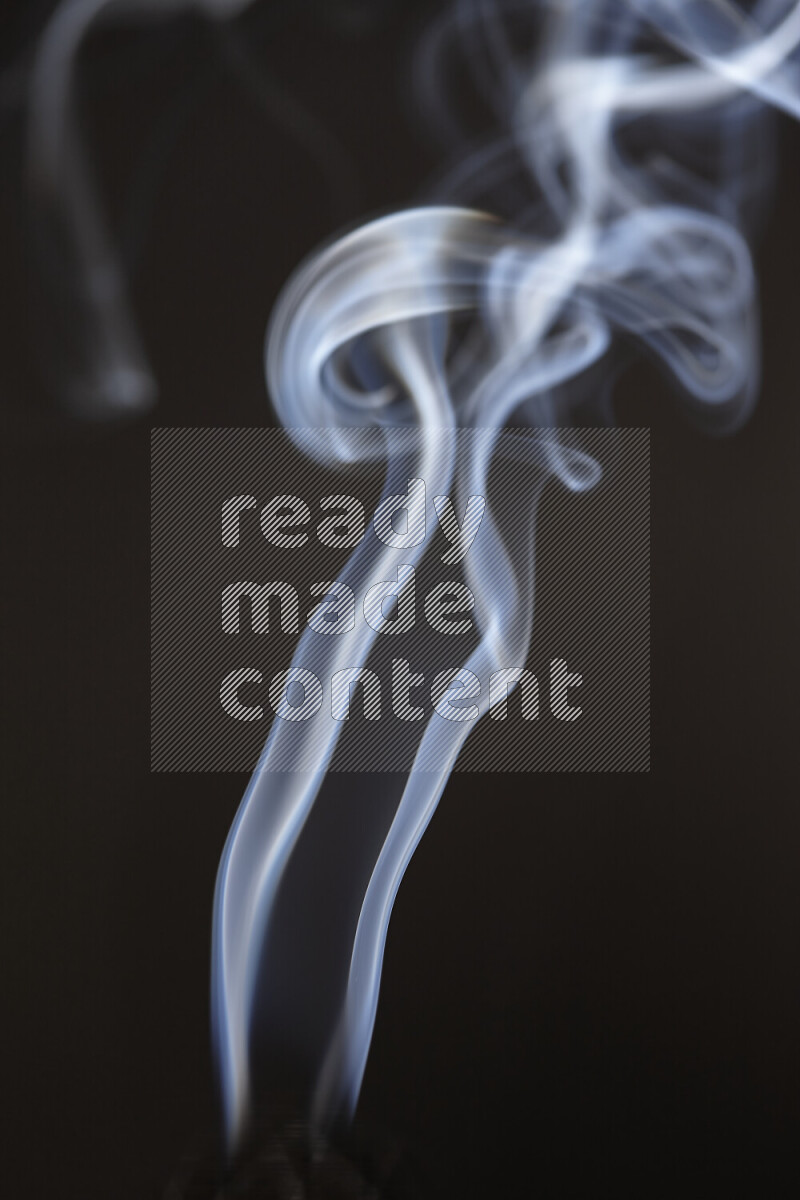 Motion of wavy smoke isolated on dark background