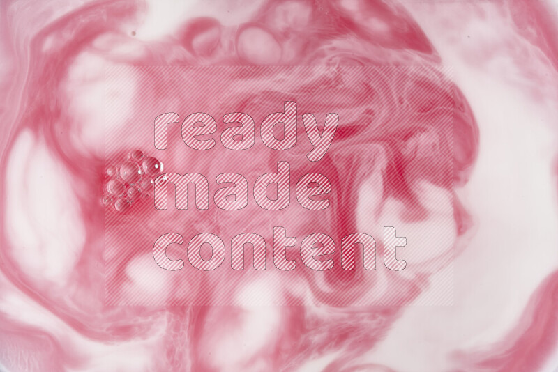 A close-up of abstract swirling patterns in red and white